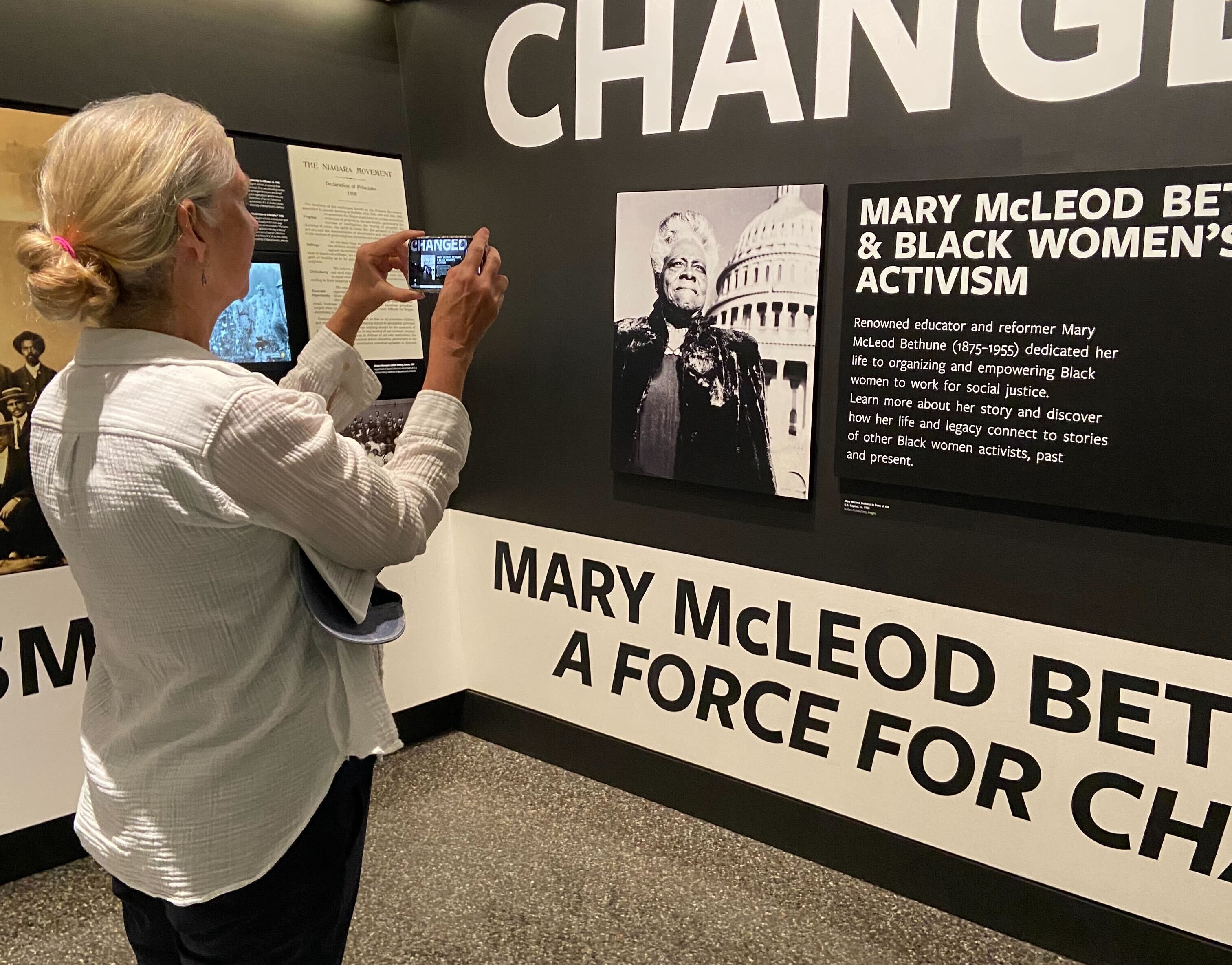 Shelley Smith, a retired public health professional, is one of hundreds of volunteers taking part in an effort to document wall text, objects and images at the Smithsonian.